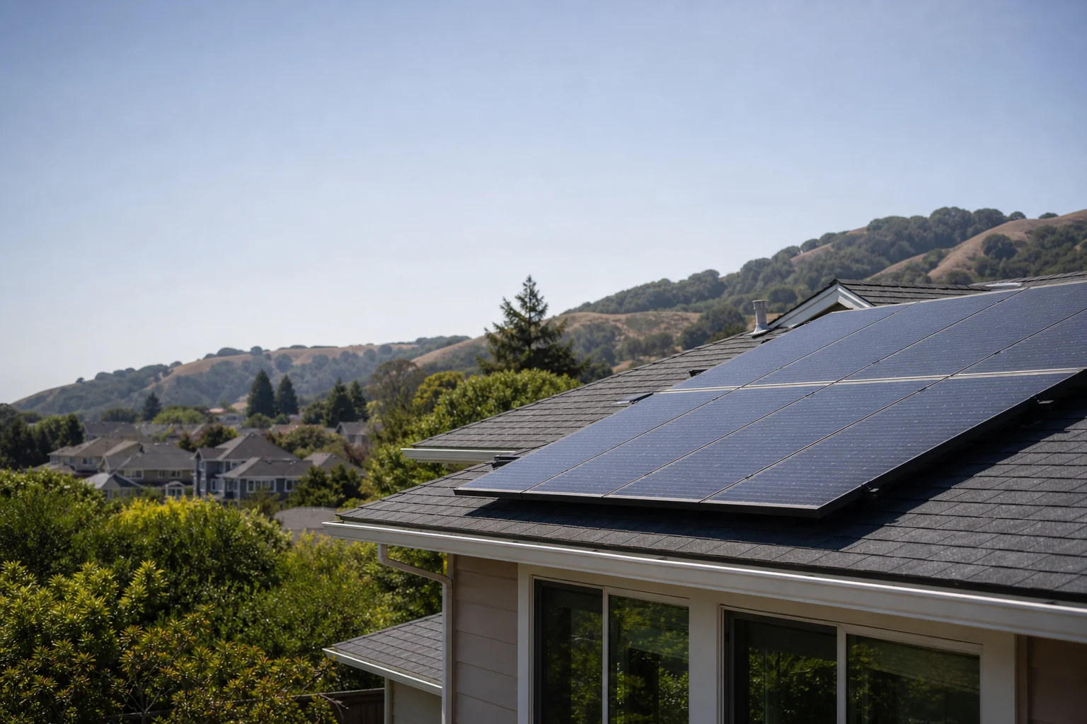 Solar panels installed on a residential roof in a California hillside neighborhood